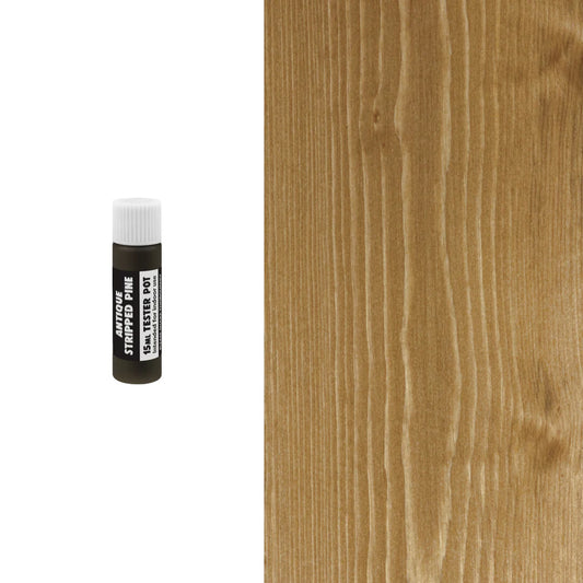 Small bottle of wood finish next to a wooden surface