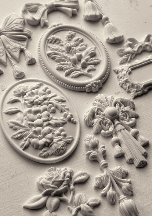 Decorative Iron Orchid Designs mould with floral and leaf patterns on a textured surface