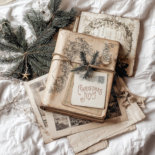 Stack of vintage books with Christmas decorations on white using IOD Stamps