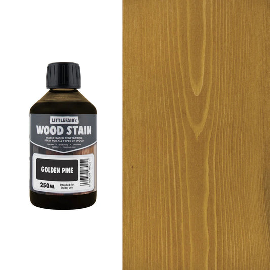 Bottle of Littlefain's Wood Stain with Golden Pine color swatch on a wooden surface