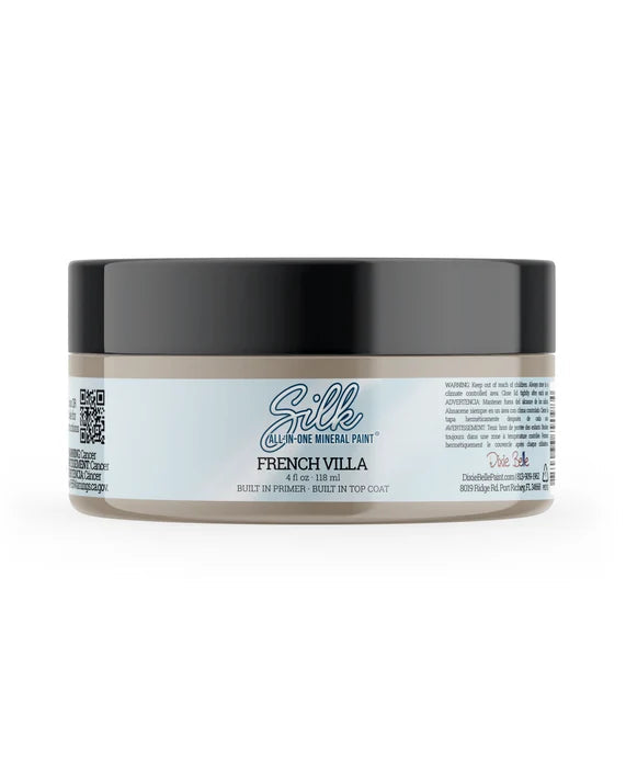 A jar of Silk French Villa Mineral Paint  'Built in Primer - Built in Top Coat', featuring a black lid and a white label with blue text, set against a plain white background.