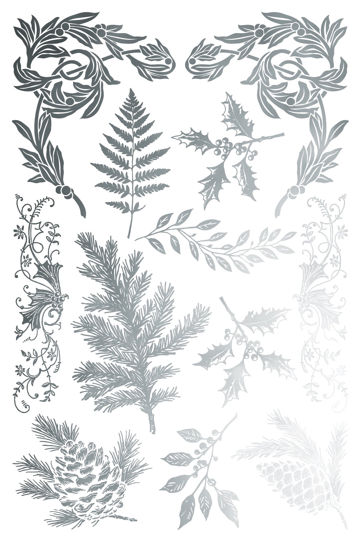 Decorative arrangement of silver leaves and branches on a white background
