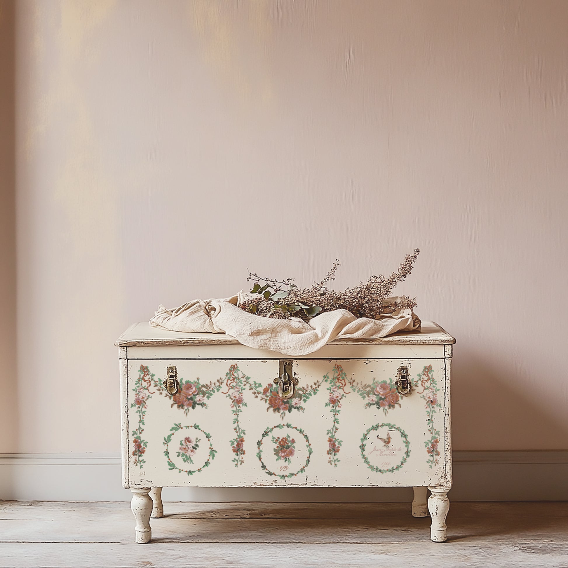 Decorative chest with floral patterns on a plain wall background using IOD Paint Inlays