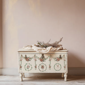 Decorative chest with floral patterns on a plain wall background using IOD Paint Inlays