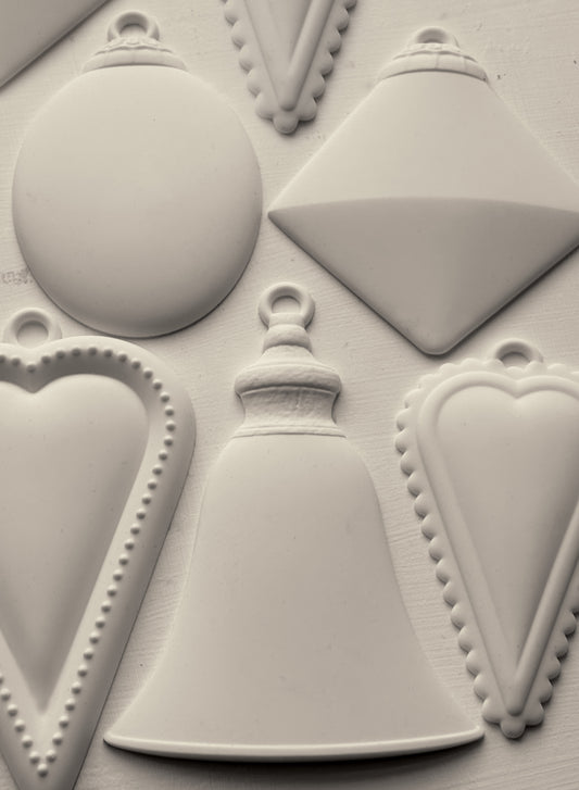 Close-up of a silicone mold with geometric Christmas Bauble shapes and decorative elements.