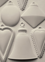 Load image into Gallery viewer, Close-up of a silicone mold with geometric Christmas Bauble shapes and decorative elements.