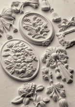 Load image into Gallery viewer, Decorative Iron Orchid Designs mould with floral and leaf patterns on a textured surface