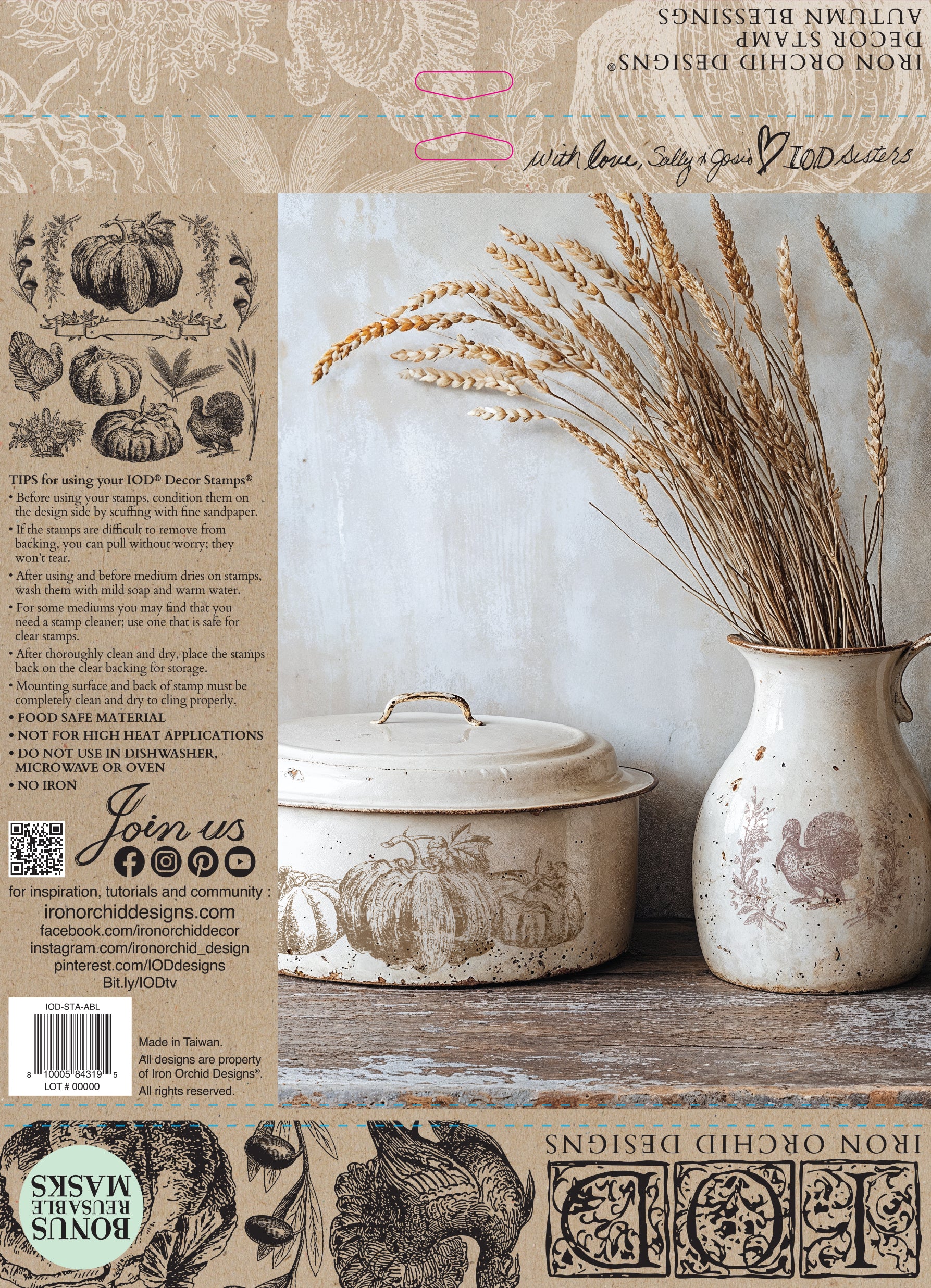 Decorative items including a ceramic jar and a vase with wheat on a the packaging for Iron Orchid Designs Stamp
