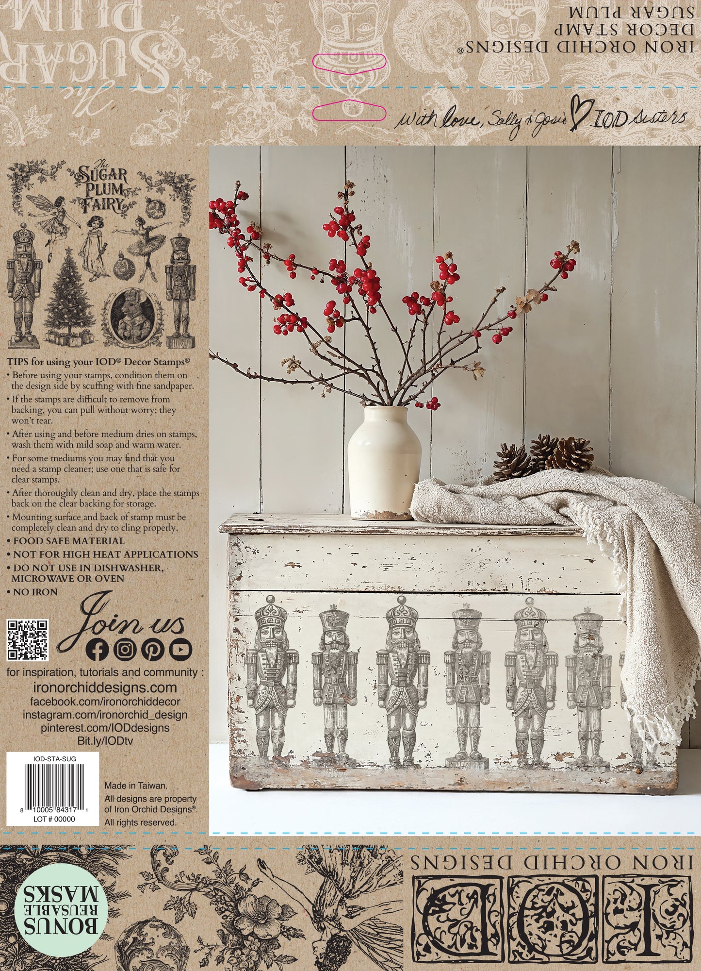 The back cover of IOD Stamp Sugar Plum featuring decorative chest with Nutcracker design, white vase with red flowers, and wooden wall background.