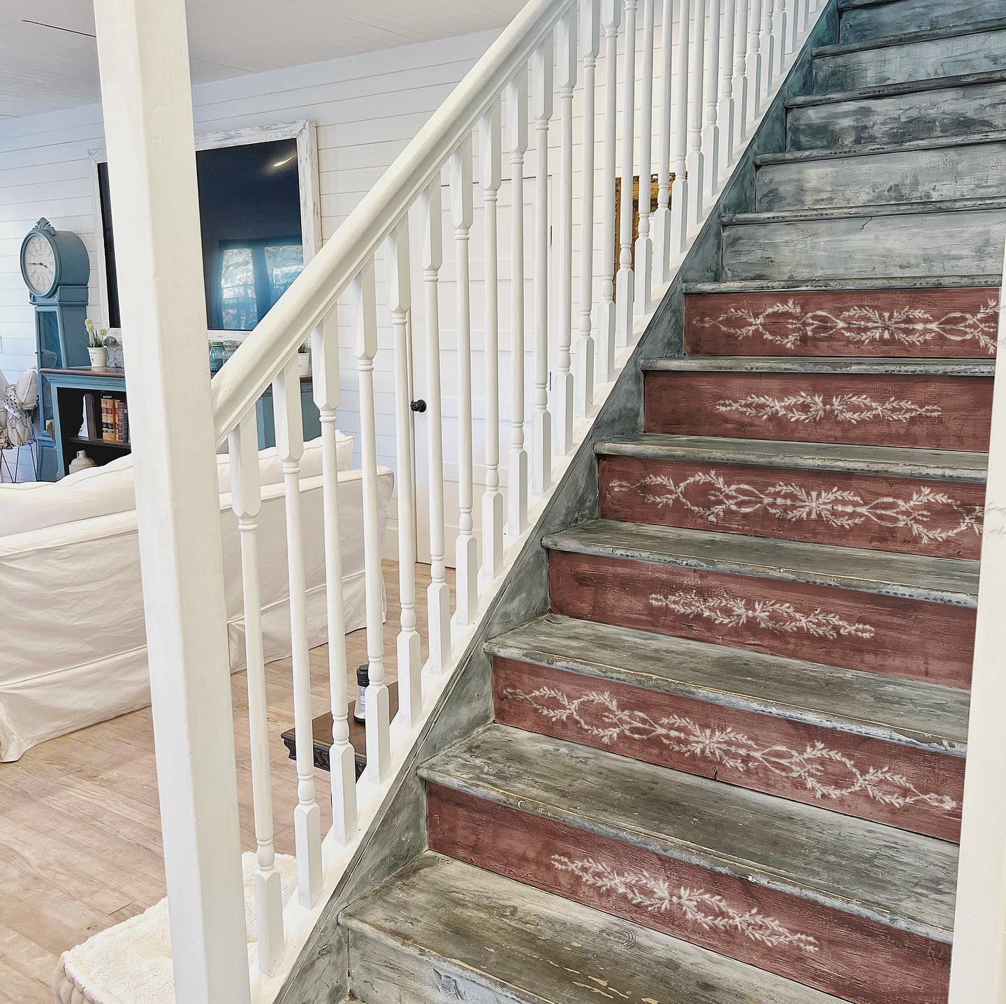 Wooden staircase with decorative red and gray steps using IOD Paint Inlay Trompe L'Oeil  in a home interior.