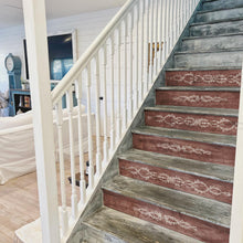 Load image into Gallery viewer, Wooden staircase with decorative red and gray steps using IOD Paint Inlay Trompe L&#39;Oeil  in a home interior.