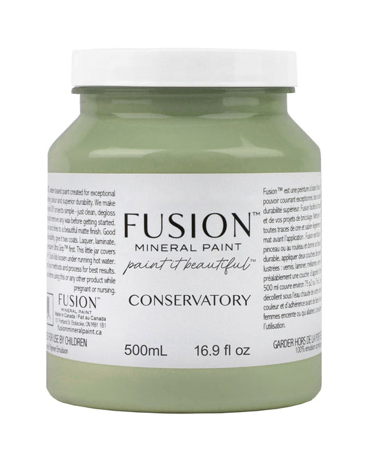 A 500ml jar of Fusion Mineral Paint in the Conservatory shade, featuring a white lid and a white label with black text, set against a plain white background.