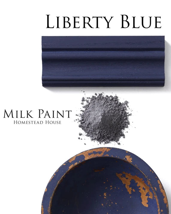 Milk paint sample in Liberty Blue with a container and powder on a white background