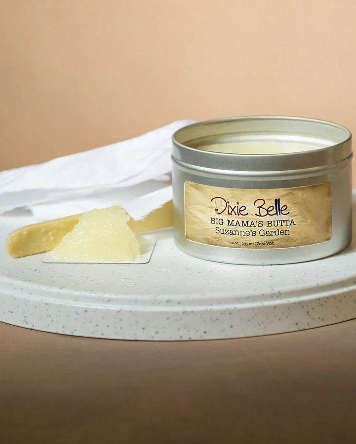 Jar of 'Big Mama's Butter' on a white plate with a beige background
